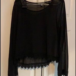 Sheer long sleeve black shirt. One size fits all.
